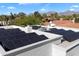 Roof featuring solar panels with beautiful mountain views at 8515 E Sutton Dr, Scottsdale, AZ 85260