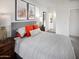 Serene bedroom featuring a comfortable bed, stylish decor, and natural light at 8950 W Albeniz Pl, Tolleson, AZ 85353