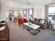 Bright open-concept living area with a large island and modern decor at 8950 W Albeniz Pl, Tolleson, AZ 85353