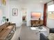 Stylish living area with a wooden desk and decorative items at 8950 W Albeniz Pl, Tolleson, AZ 85353