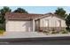 Beautiful single-story home with a two-car garage and stone accents at 8954 W Albeniz Pl, Tolleson, AZ 85353