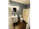 Bathroom featuring modern fixtures, including a stylish vanity and combined shower and tub at 9021 W Elm St # 7, Phoenix, AZ 85037