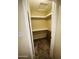 Bedroom closet with shelving unit featuring carpet flooring at 9021 W Elm St # 7, Phoenix, AZ 85037