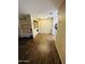 Open kitchen concept with shelving unit and washer and dryer at 9021 W Elm St # 7, Phoenix, AZ 85037