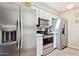 Modern kitchen featuring stainless steel appliances and ample countertop space at 9021 W Elm St # 7, Phoenix, AZ 85037