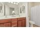 Bathroom featuring double vanity with wood cabinets, tile floors, and shower with curtain at 9234 W Hedge Hog Pl, Peoria, AZ 85383