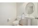 Powder bathroom with white fixtures, tile flooring and natural light at 9234 W Hedge Hog Pl, Peoria, AZ 85383
