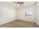 Bedroom featuring carpet, a ceiling fan, and a bright window for added light at 9234 W Hedge Hog Pl, Peoria, AZ 85383
