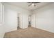 A carpeted bedroom features doors to a bathroom and closet for convenience at 9234 W Hedge Hog Pl, Peoria, AZ 85383