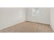 Bright bedroom featuring neutral walls, carpet flooring, and a large window at 9234 W Hedge Hog Pl, Peoria, AZ 85383