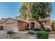 Charming two-story home featuring a neutral color palette, two-car garage, and desert landscaping at 9234 W Hedge Hog Pl, Peoria, AZ 85383