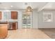 Kitchen with backyard pool view through sliding glass doors and light fixture at 9234 W Hedge Hog Pl, Peoria, AZ 85383