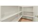 Walk-in pantry with built-in shelving, and tile flooring at 9234 W Hedge Hog Pl, Peoria, AZ 85383