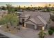 Stunning aerial view of a well-manicured property featuring a three-car garage at 14424 N 64Th Pl, Scottsdale, AZ 85254