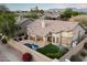 Inviting backyard featuring a pool, patio, and manicured landscaping, perfect for outdoor living and entertaining at 14424 N 64Th Pl, Scottsdale, AZ 85254