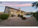 Lush backyard with covered patio, sparkling pool, and neatly maintained landscaping at 14424 N 64Th Pl, Scottsdale, AZ 85254