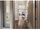 Inviting foyer featuring wood flooring, neutral walls, and a view into the living area at 14424 N 64Th Pl, Scottsdale, AZ 85254