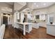 Spacious kitchen featuring two islands, white cabinets, modern appliances, and ample counter space at 14424 N 64Th Pl, Scottsdale, AZ 85254