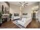 Spacious living room with fireplace, hardwood floors, modern furnishings, and a light color scheme at 14424 N 64Th Pl, Scottsdale, AZ 85254