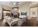 Bright living room with modern furnishings, fireplace, neutral colors, and access to the backyard at 14424 N 64Th Pl, Scottsdale, AZ 85254