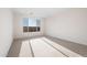 Bright bedroom showcasing a neutral color palette and a large window at 21278 N 272Nd Ave, Buckeye, AZ 85396