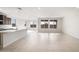 Bright and open great room featuring neutral tile, white trim, and large windows providing ample natural light at 21278 N 272Nd Ave, Buckeye, AZ 85396