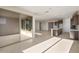 Open floor plan showing kitchen, dining and Gathering room with sliding glass door access to back patio at 21278 N 272Nd Ave, Buckeye, AZ 85396