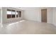 Open living room space with neutral tile, large windows, and plenty of natural light at 21278 N 272Nd Ave, Buckeye, AZ 85396