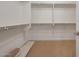 Walk-in closet with carpeted floor and featuring hanging racks and shelving at 21278 N 272Nd Ave, Buckeye, AZ 85396