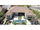 Beautiful backyard with large patio, swimming pool, and well manicured artificial lawn at 21623 S 223Rd Pl, Queen Creek, AZ 85142