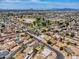 Aerial view showing the neighborhood and a nearby community park with green spaces and recreational areas at 625 S Daley --, Mesa, AZ 85204