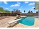 Backyard with a refreshing pool, diving board, and ample space for outdoor enjoyment at 625 S Daley --, Mesa, AZ 85204