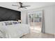 Bright bedroom with ceiling fan offers sliding door and tile flooring at 625 S Daley --, Mesa, AZ 85204