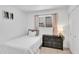 Cozy bedroom featuring a twin bed, black dresser, and neutral walls at 625 S Daley --, Mesa, AZ 85204