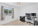 Bedroom/office with a modern computer setup next to a bright window at 625 S Daley --, Mesa, AZ 85204