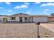 Charming single-story home with a brick facade, well-maintained yard, and a two-car garage at 625 S Daley --, Mesa, AZ 85204