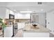 Bright kitchen featuring white cabinets, stainless steel appliances, granite countertops, and a large island at 625 S Daley --, Mesa, AZ 85204