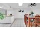 Open concept kitchen and dining room with tiled floors and granite countertops at 625 S Daley --, Mesa, AZ 85204