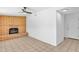 Neutral room features brick fireplace with tile floors, ceiling fan, and white walls at 625 S Daley --, Mesa, AZ 85204