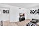 Open concept living area with tile floors, TV, and views to another room at 625 S Daley --, Mesa, AZ 85204
