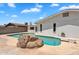Backyard pool featuring a diving board and a large rock formation at 625 S Daley --, Mesa, AZ 85204