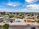 Street-level view of a single-story home with a white exterior and well-maintained front yard at 625 S Daley --, Mesa, AZ 85204