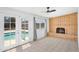 Sun room with French doors leading to a pool and a classic brick fireplace at 625 S Daley --, Mesa, AZ 85204