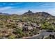 This elevated view reveals an upscale community surrounded by desert landscaping and the grandeur of Black Mountain at 10057 E Blue Sky Dr, Scottsdale, AZ 85262