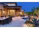 This cozy patio features a dining area, a small spa, and desert landscaping with cacti and native plants at 10057 E Blue Sky Dr, Scottsdale, AZ 85262