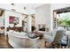 Spacious living room featuring a stone fireplace, wood floors, and views to other living areas at 10057 E Blue Sky Dr, Scottsdale, AZ 85262