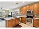 Beautiful kitchen with stainless steel appliances, ample cabinetry, and an inviting view of the living space at 10224 S 175Th Ave, Goodyear, AZ 85338