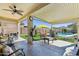 Inviting covered patio featuring comfortable seating and a view of the refreshing pool at 10224 S 175Th Ave, Goodyear, AZ 85338