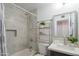 Cozy bathroom featuring shower-tub combo, updated vanity, and modern fixtures with a neutral color palette at 10713 E Oasis Dr, Mesa, AZ 85208