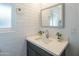 Well-lit bathroom with sleek vanity, framed mirror, and modern fixtures, offering a clean aesthetic at 10713 E Oasis Dr, Mesa, AZ 85208